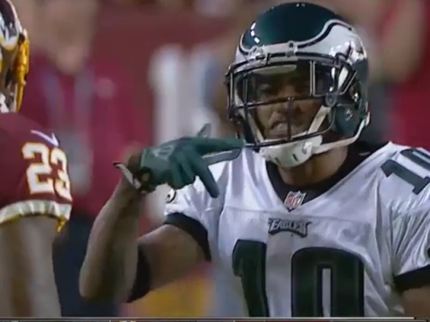 Desean Jackson flashing what appears to be a gang sign at DeAngelo Hall.